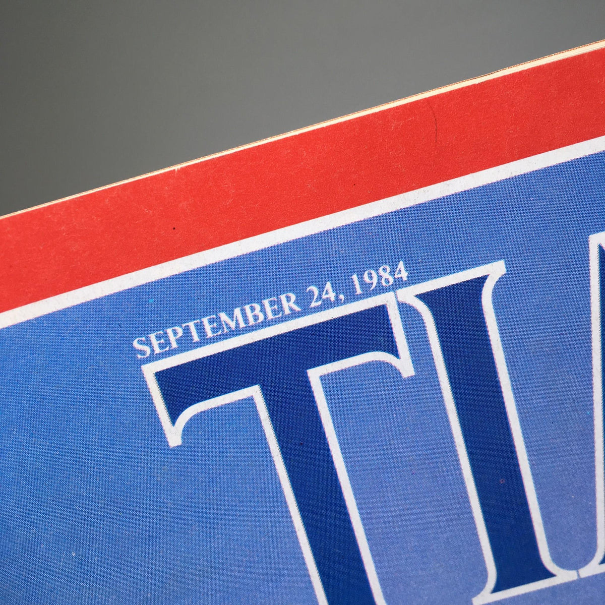 Close-up of the date 'September 24, 1984' from the Time Magazine cover titled 'America's Upbeat Mood: I Love U.S.'.