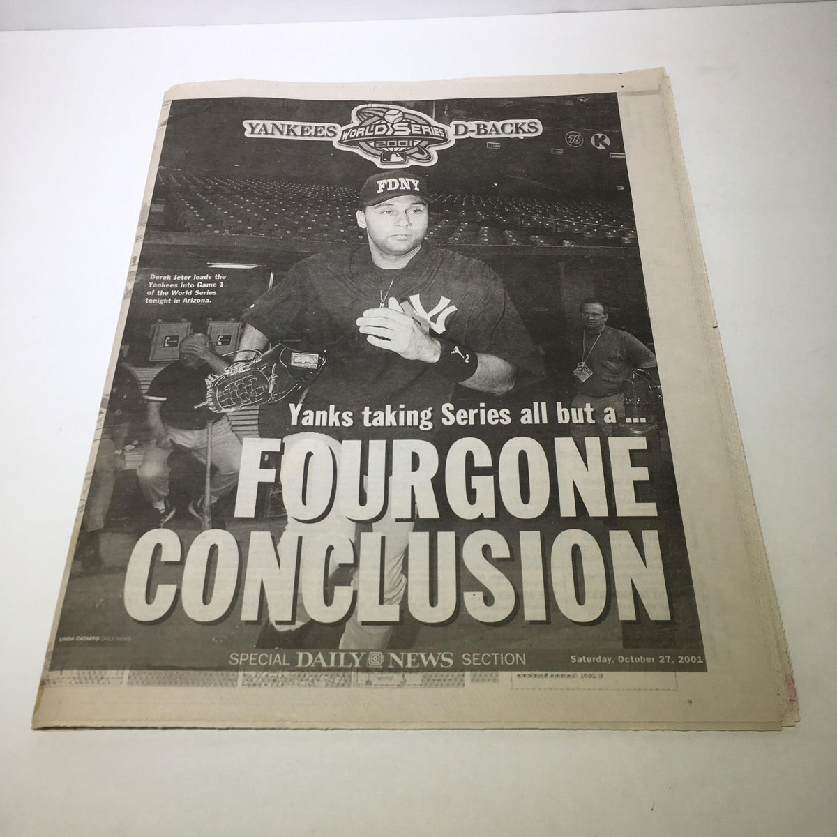 Front page of NY Daily News from October 27, 2001, featuring the headline 'Yanks Taking Series All But A FourGone Conclusion' with an image of a New York Yankees player, commemorating the World Series matchup against the Arizona Diamondbacks.