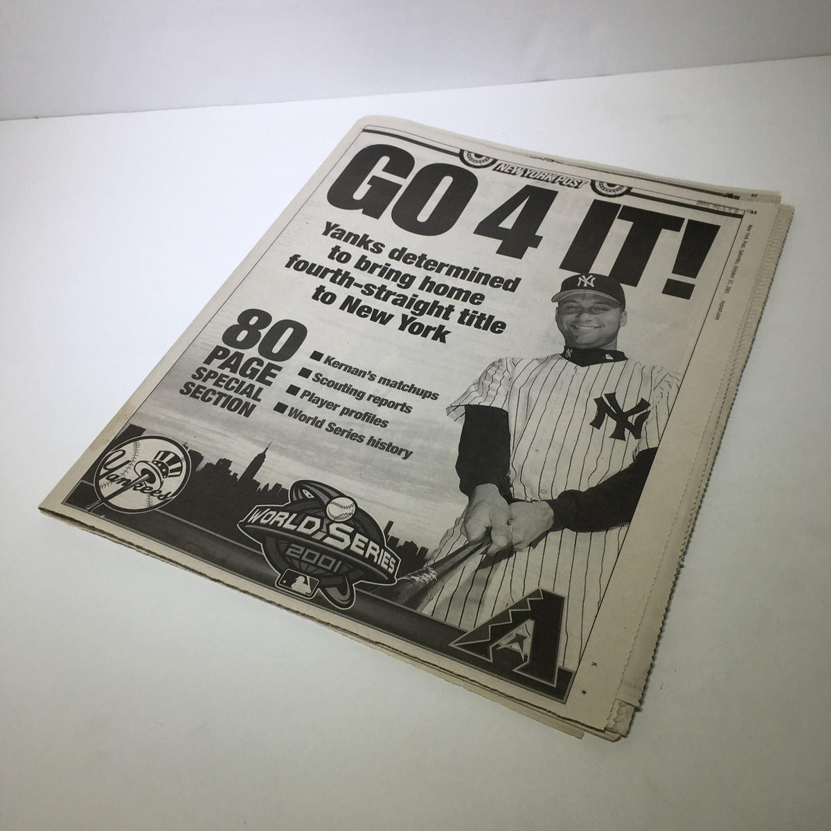Another view of the NY Post front page from October 27, 2001, displaying the title 'GO 4 IT! Yanks determined to bring home fourth-straight title to New York' along with sports section details.