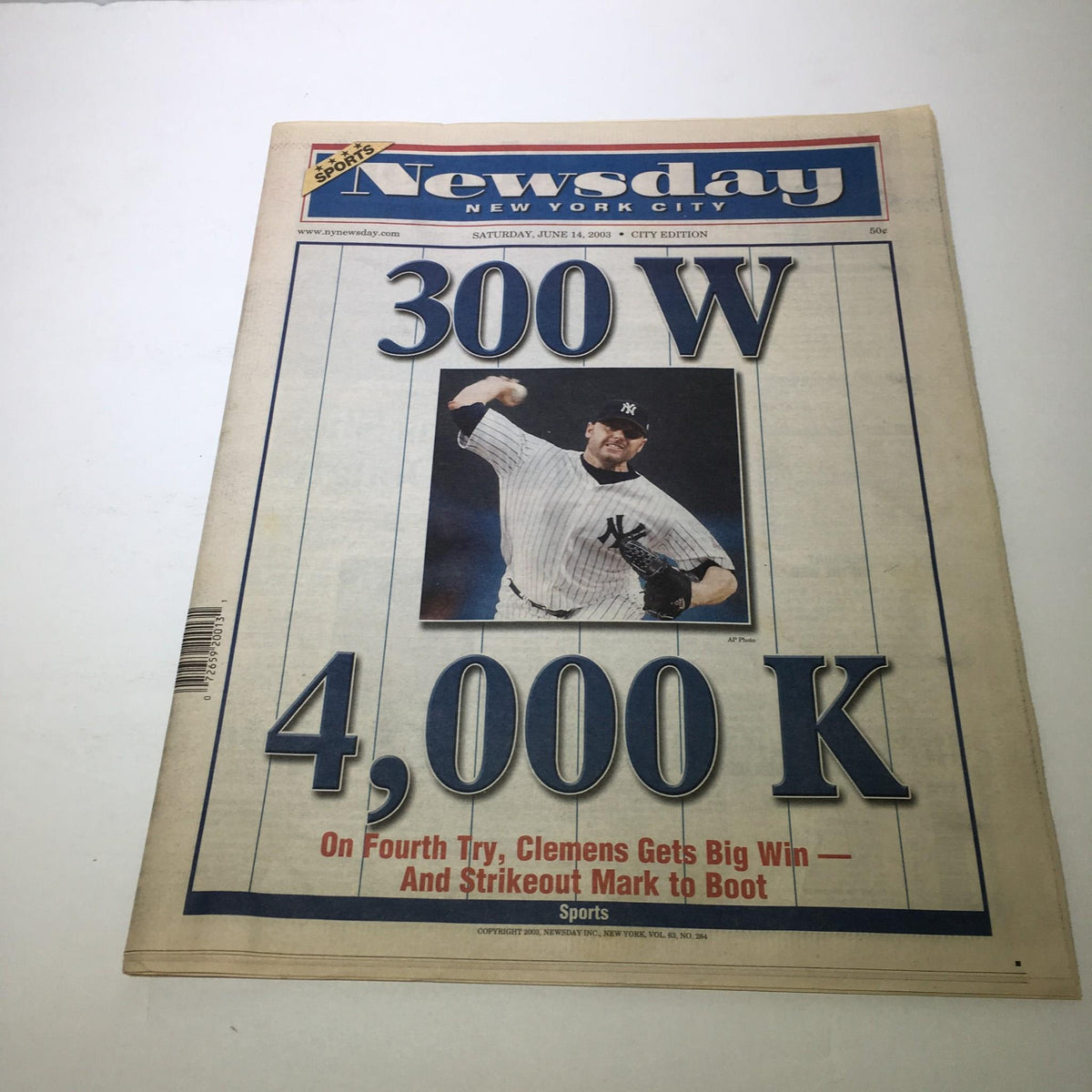 Newsday newspaper cover from June 14, 2003 featuring the headline '300 W 4,000 K' with a photo of pitcher Clemens celebrating his big win on the fourth try, announcing his strikeout milestone and sports achievements.