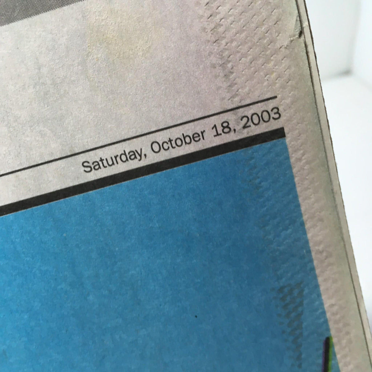 Close-up of the NY Daily News publication date, Saturday, October 18, 2003, located at the top of the page.