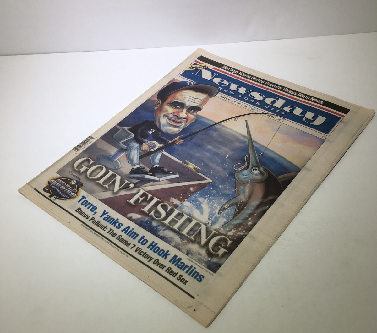 Front page of Newsday, dated October 18, 2003, titled 'Goin' Fishing' with a cartoon of Joe Torre and a fishing theme, highlighting the Yankees' aim to hook the Marlins.