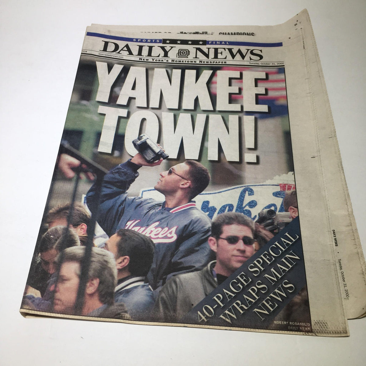 NY Daily News October 31, 2000 edition featuring headline 'YANKEE TOWN!' showcasing fans celebrating with a camera.