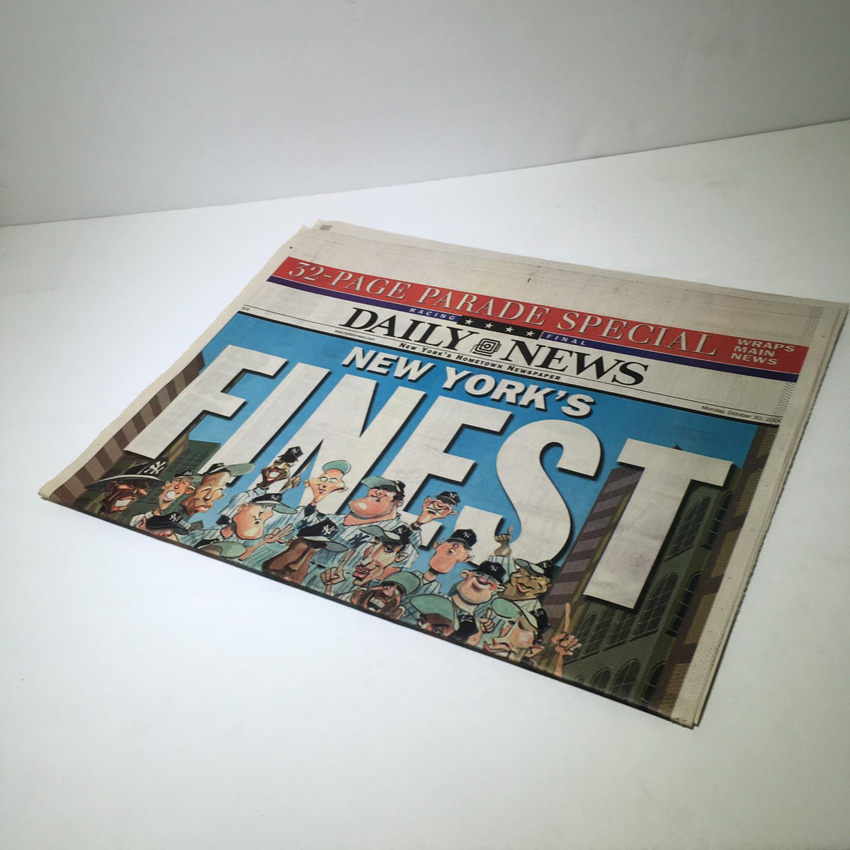 NY Daily News: Oct 30 2000 front cover with bold title 'New York's Finest', depicting a cartoonish crowd of New Yorkers and Yankees players.