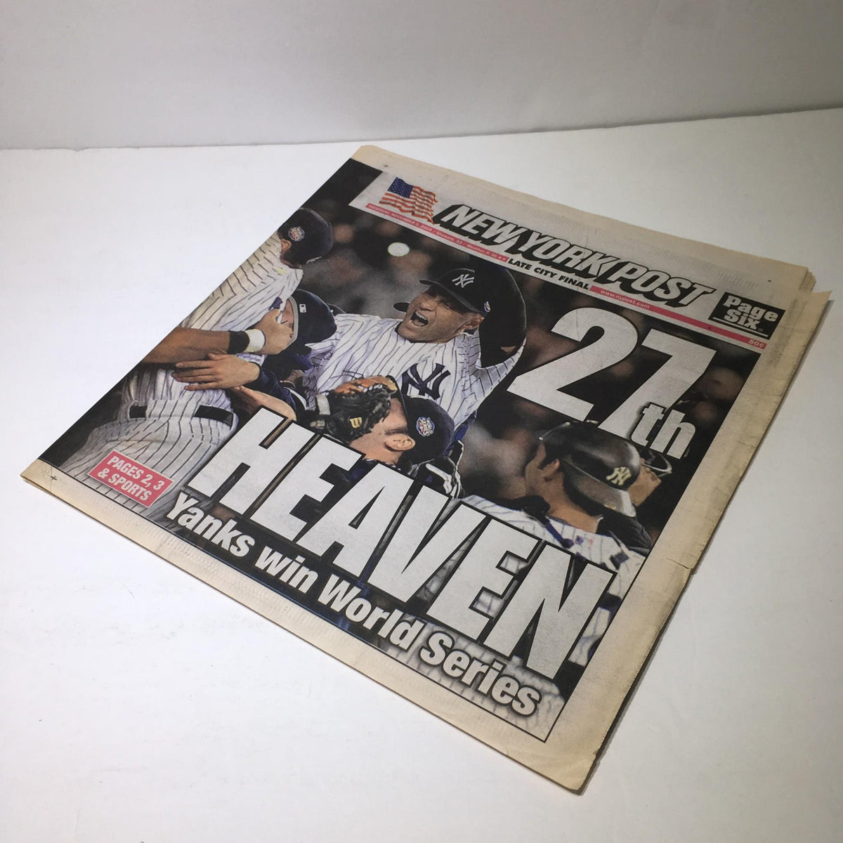 Angle view of the New York Post from Nov 5, 2009, highlighting the '27th Heaven Yanks Win World Series' headline with images of jubilant players.