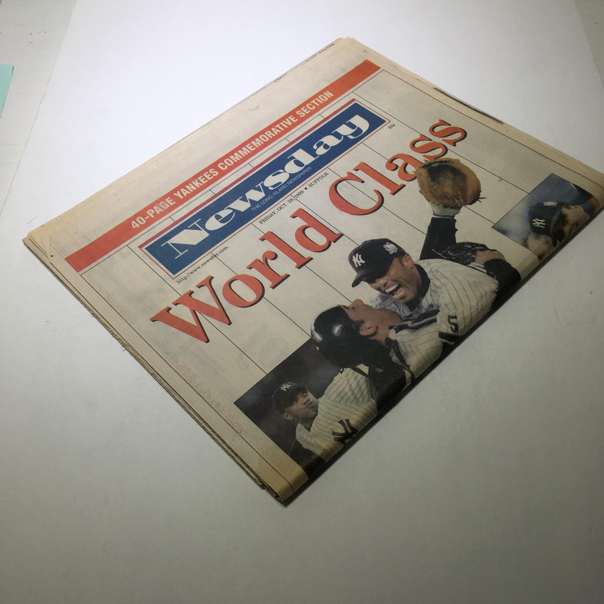 Side view of Newsday: October 29 1999 newspaper, displaying the title 'World Class' alongside celebratory images of Yankees players.