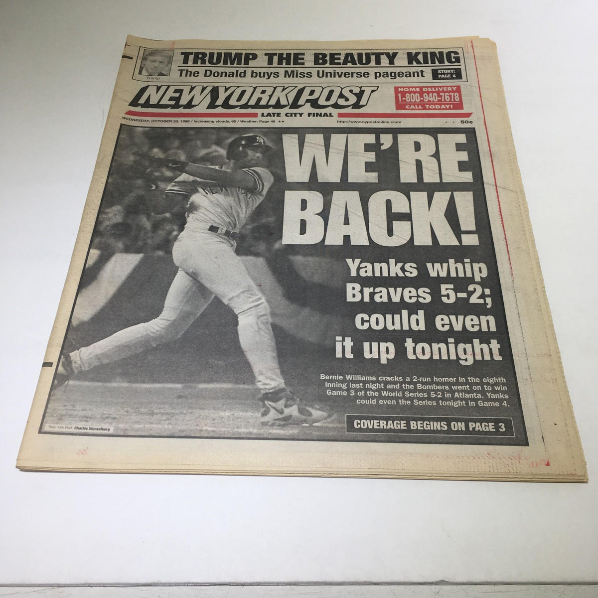 New York Post front page from October 23, 1996, titled 'WE'RE BACK!' featuring the Yankees defeating the Braves 5-2, with a photo of player Bernie Williams hitting a home run.