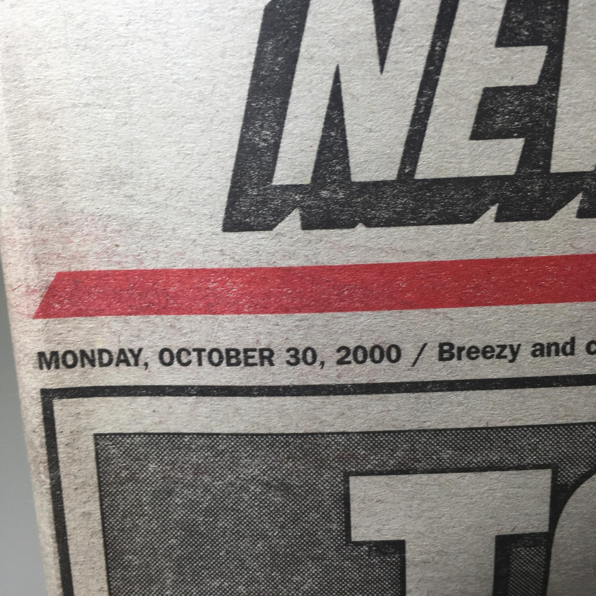 Close-up of the New York Post date stamp indicating 'Monday, October 30, 2000' on the newspaper featuring 'Toast of the Town' headline.