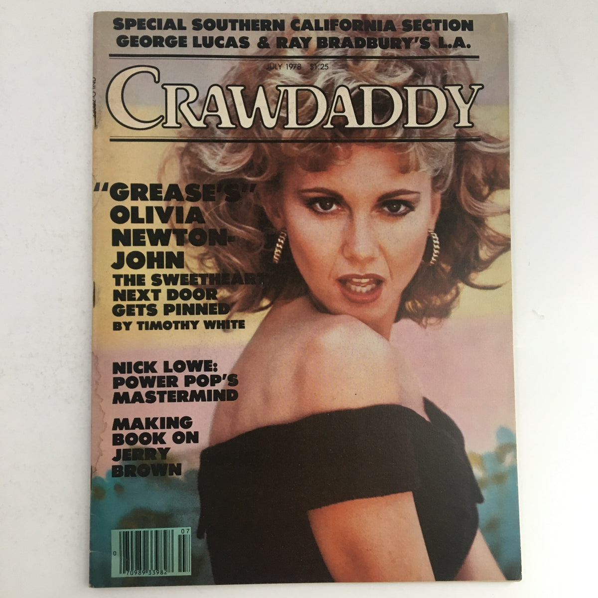 Crawdaddy Magazine July 1978 cover featuring Olivia Newton-John, showcasing her iconic look from the film Grease and highlighting Nick Lowe. Ideal collectible for fans of 1970s pop culture.