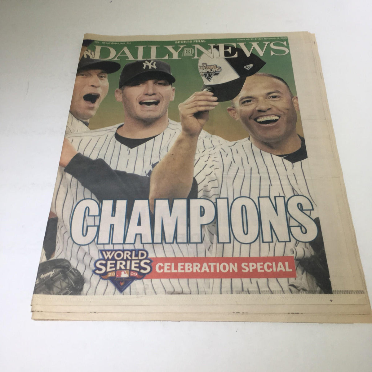 NY Daily News: Nov 6 2009 Parade of Champions World Series Celebration Special highlighting celebrating Yankees players holding up their caps in triumph.