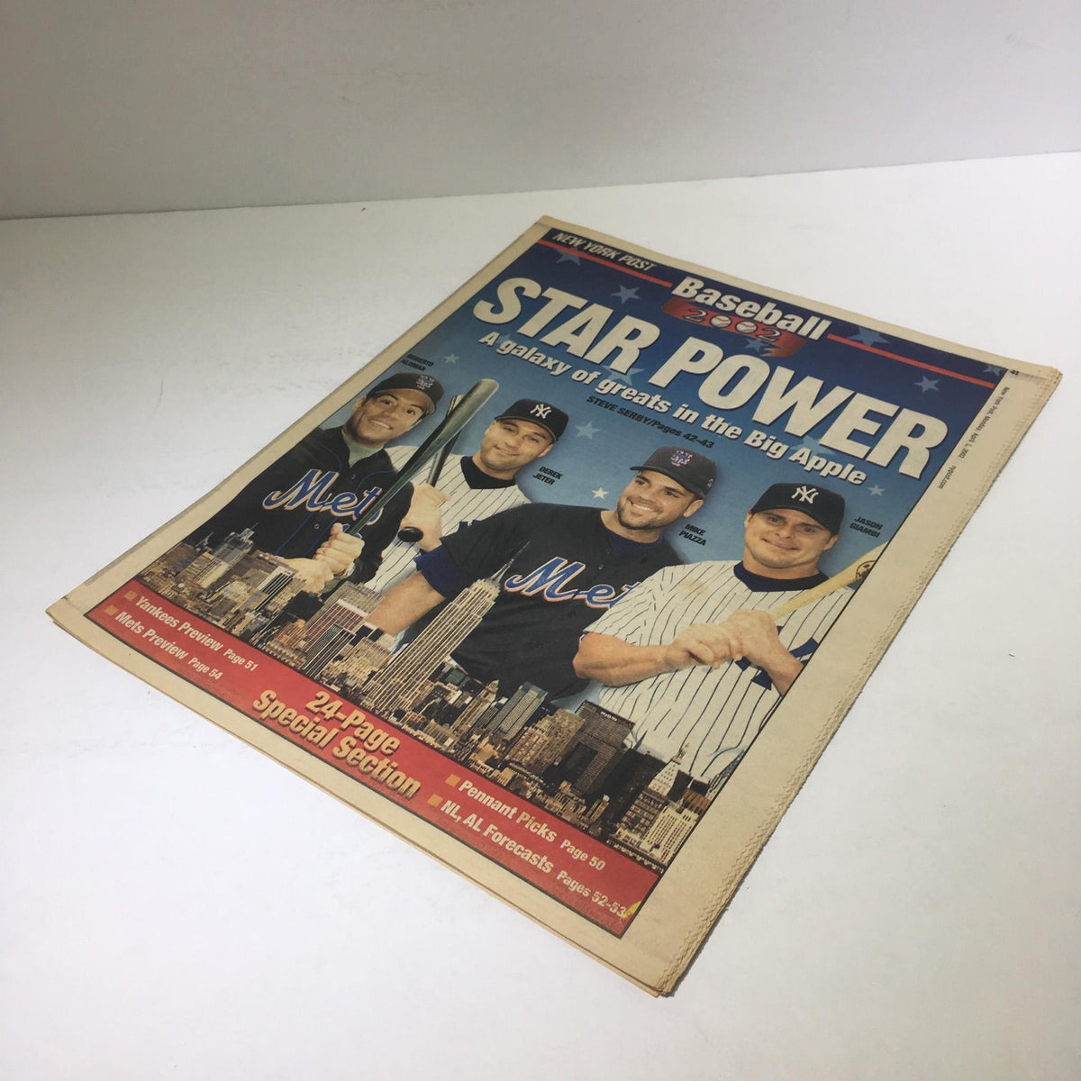 Cover of the New York Post from April 1, 2002, titled 'Star Power: A Galaxy of Great in the Big Apple', featuring prominent baseball players in Yankees uniforms. The image showcases a vibrant city skyline background, highlighting the excitement of baseball in New York.