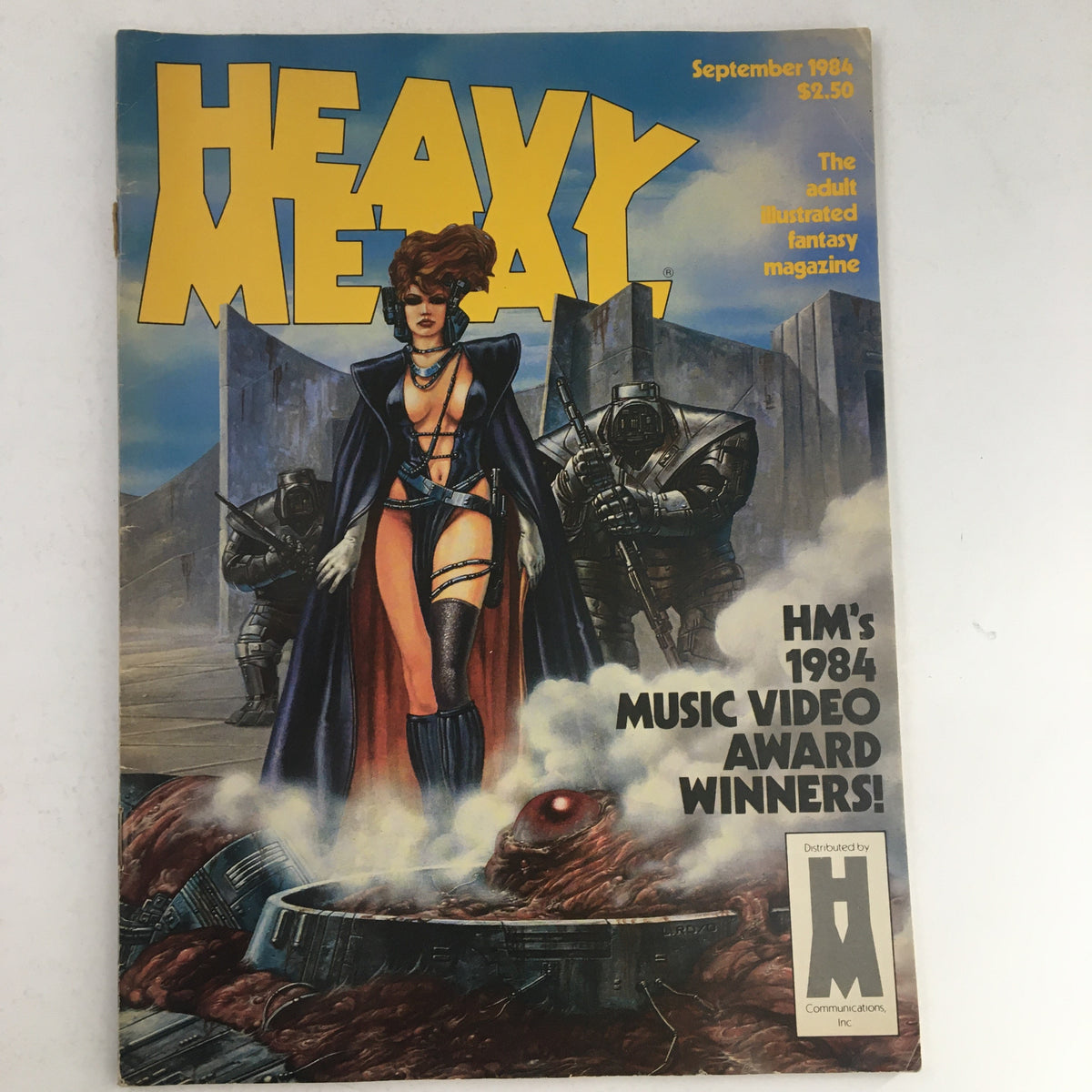 Cover of Heavy Metal Fantasy Magazine September 1984 featuring striking artwork, with a female character and robotic figures, highlighting the magazine's fantasy narrative.