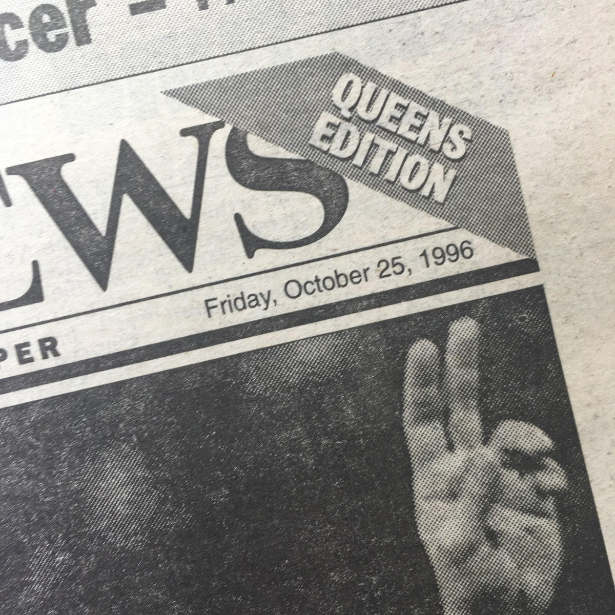 Close-up of the New York Daily News date header from October 25, 1996, showing the headlines including 'Queens Edition'.