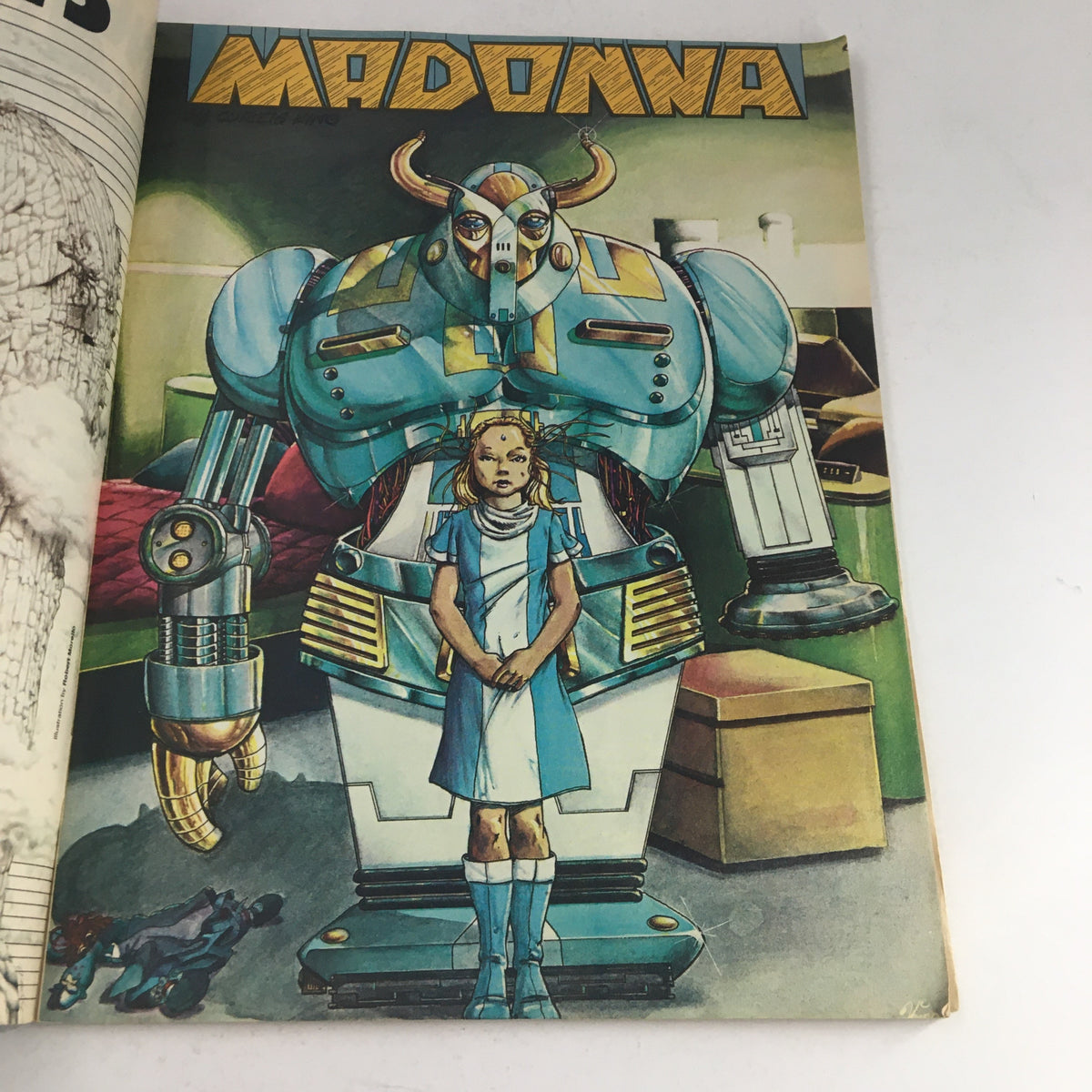 Interior page of Heavy Metal Magazine April 1979 illustrating the Madonna segment with an artistic rendering of a girl and a robot, emphasizing the magazine's unique storytelling and graphic design.