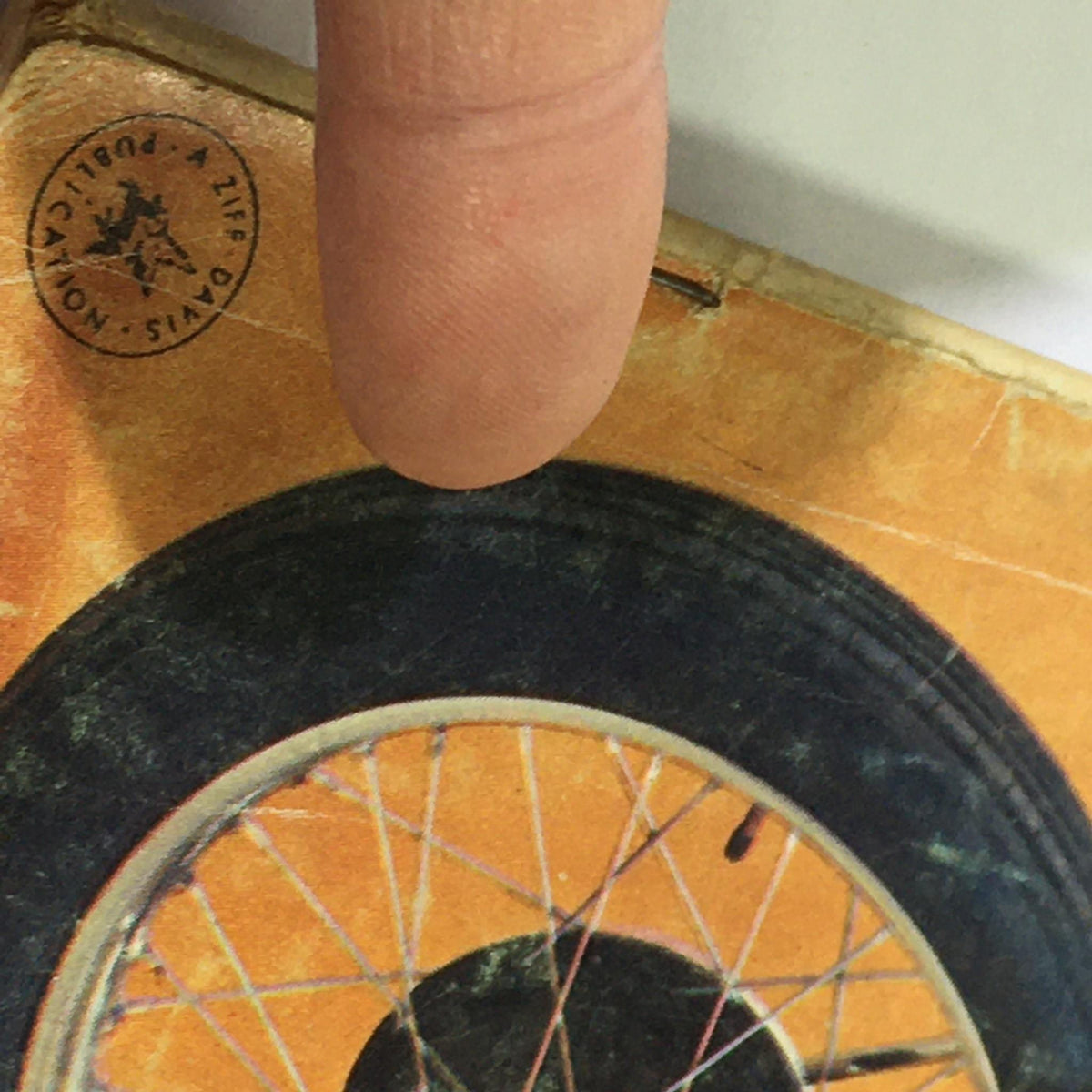 Detail of the binding and tire image on the cover of VTG Cycle Magazine March 1967, highlighting vintage motorcycle aesthetics.