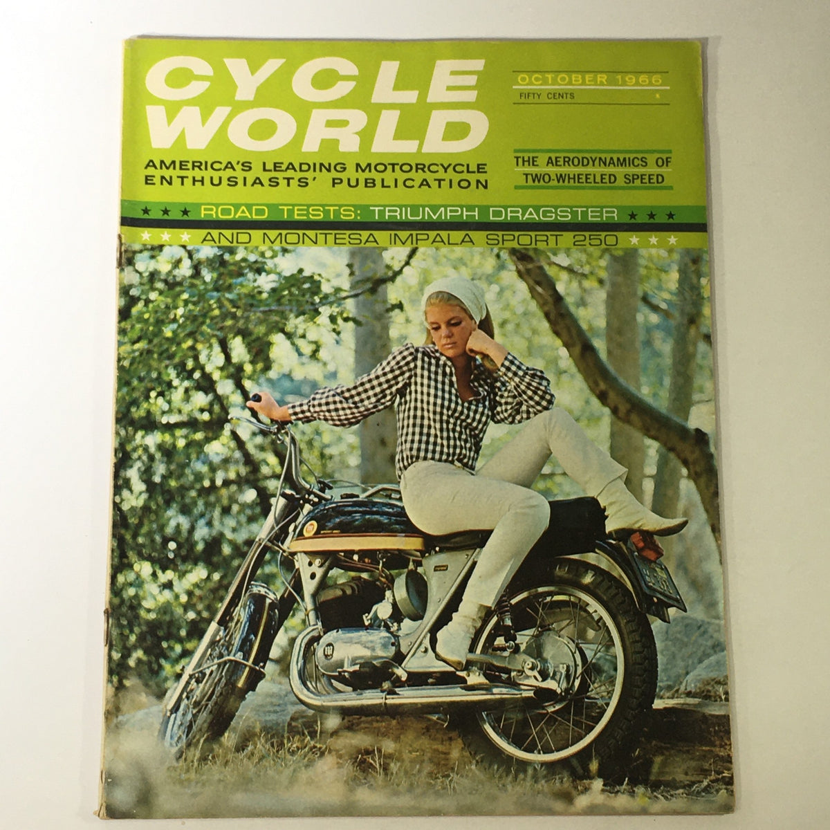 Cover of the Cycle World Magazine from October 1966 featuring the Triumph Dragster and Montesa Impala S-250 motorcycle with a blonde woman in a checked shirt posing on the bike, showcasing vintage motorcycle culture and style.