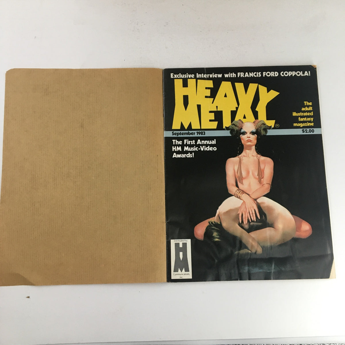 Front cover of Heavy Metal Magazine September 1983 featuring the illustration from 'The Hunt for Louth' by Alejandro Jodorowsky, promoting the first annual HM Music-Video Awards.