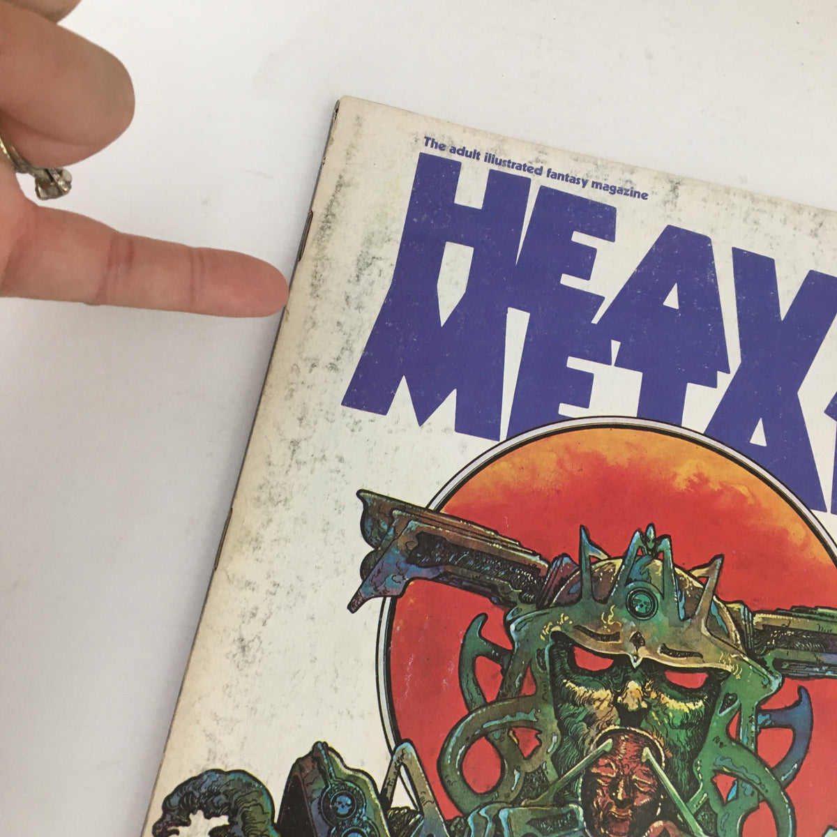Close-up view of the cover of Heavy Metal Magazine May 1978, showcasing intricate details and bold typography in the magazine's design.