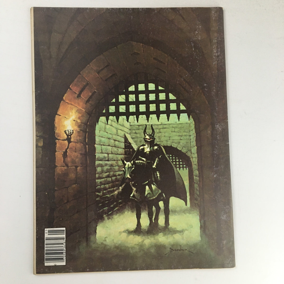 Back cover of Heavy Metal Magazine May 1978, depicting an artistic scene of a knight in a dimly lit dungeon.