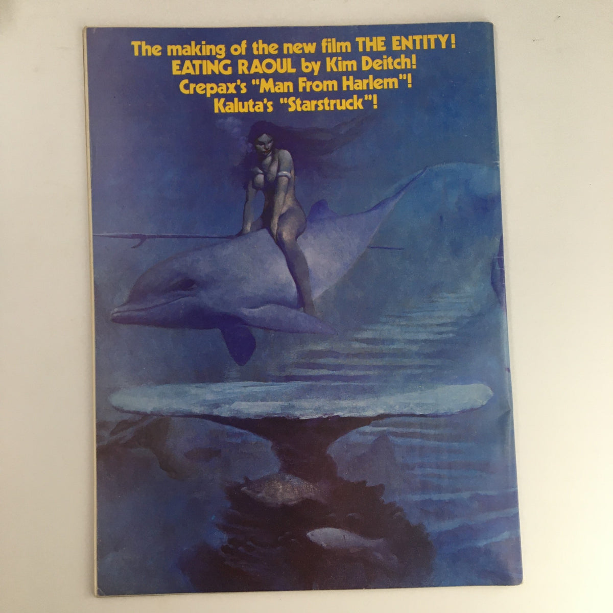 Cover of Heavy Metal Magazine February 1983 featuring a surreal illustration of a woman riding a dolphin, highlighting the story 'The Man From Harlem' by Guido Crepax, showcasing the artistic style of the magazine.
