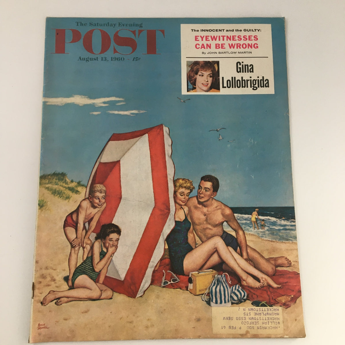 The Saturday Evening Post August 13, 1960 cover featuring Italian actress Gina Lollobrigida, showcasing a beach scene with individuals under a beach umbrella.