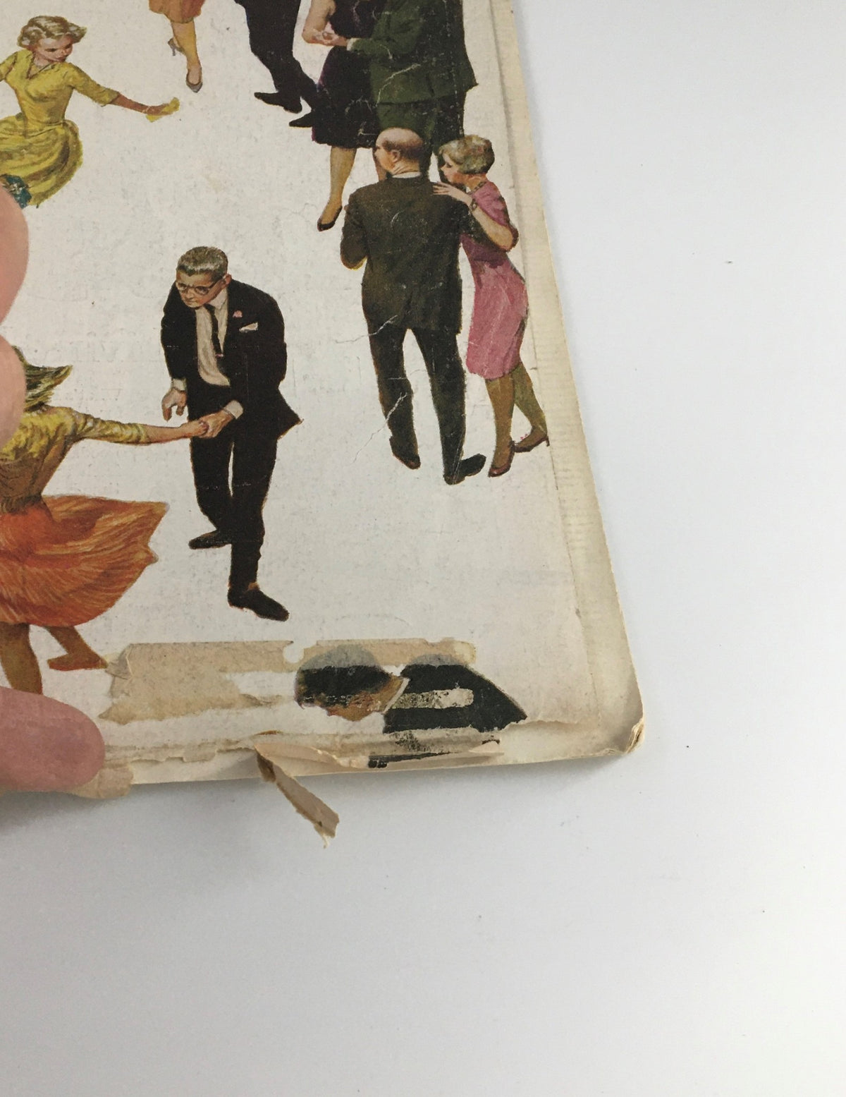 Detail of the damaged edge of The Saturday Evening Post from November 4, 1961, showing wear and tear but still featuring illustrations relevant to New York Politics and The Presidency.