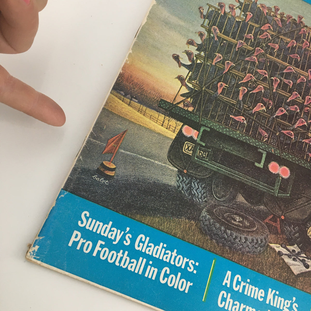 Cover image of The Saturday Evening Post from November 24, 1962, featuring a colorful illustration of a truck carrying objects under a sunset, highlighting 'The Hot War in Asia: North Vietnam' theme.