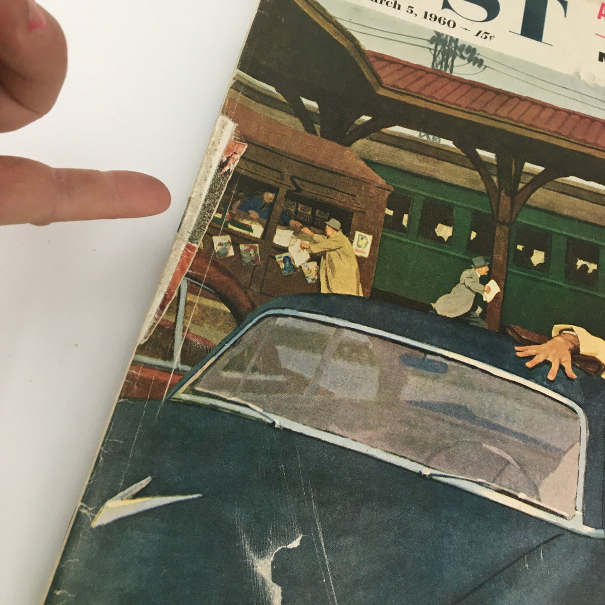 Close-up view of the cover of The Saturday Evening Post from March 5, 1960, highlighting the detailed illustration of a car and figures, along with the title 'After Khrushchev, Who?'