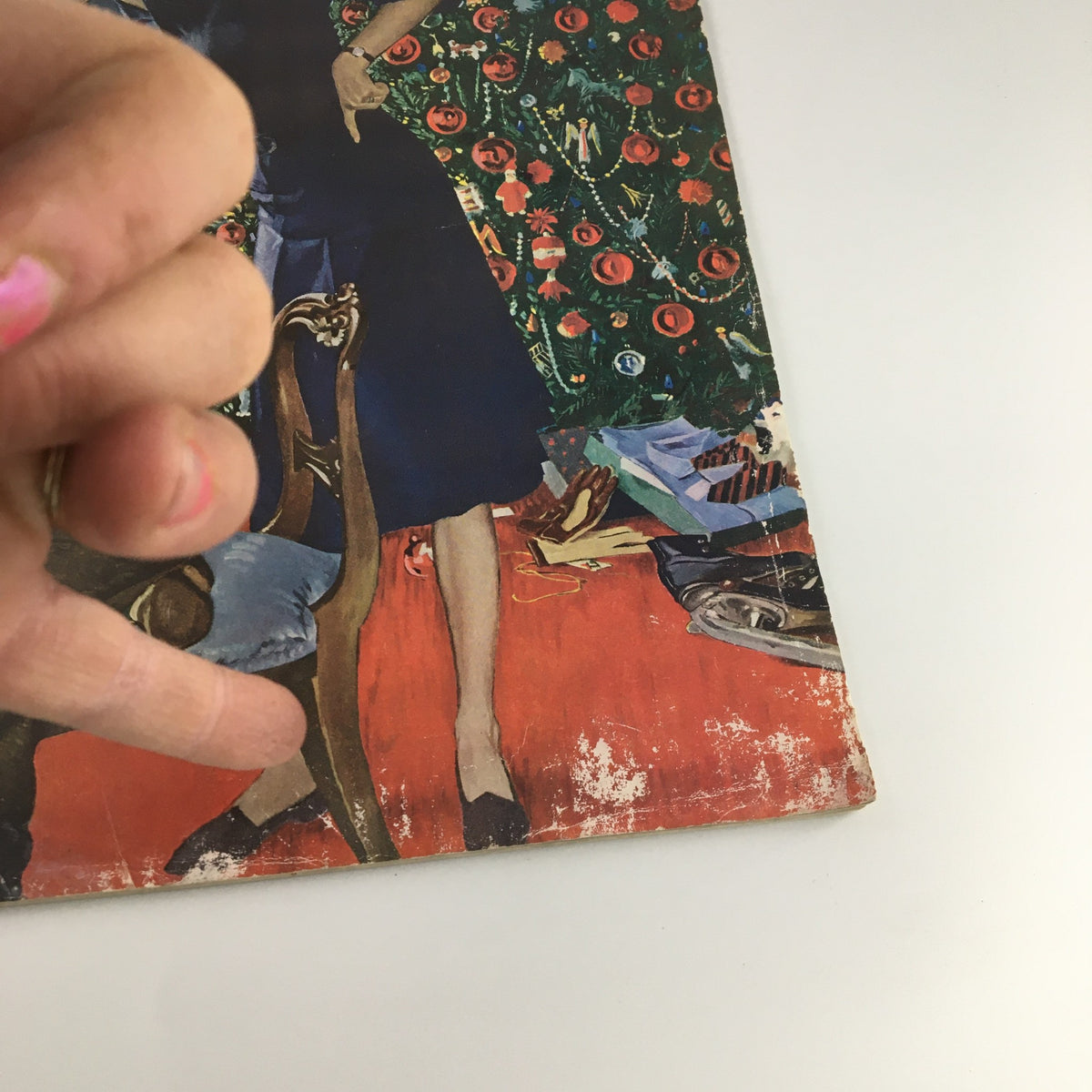 Close-up of The Saturday Evening Post cover from January 9, 1960, featuring Tony Perkins, highlighting the details of the illustration. The image showcases a woman's hand pointing, with the decorative Christmas tree and toys visible in the background, emphasizing the vintage aesthetic of the era.