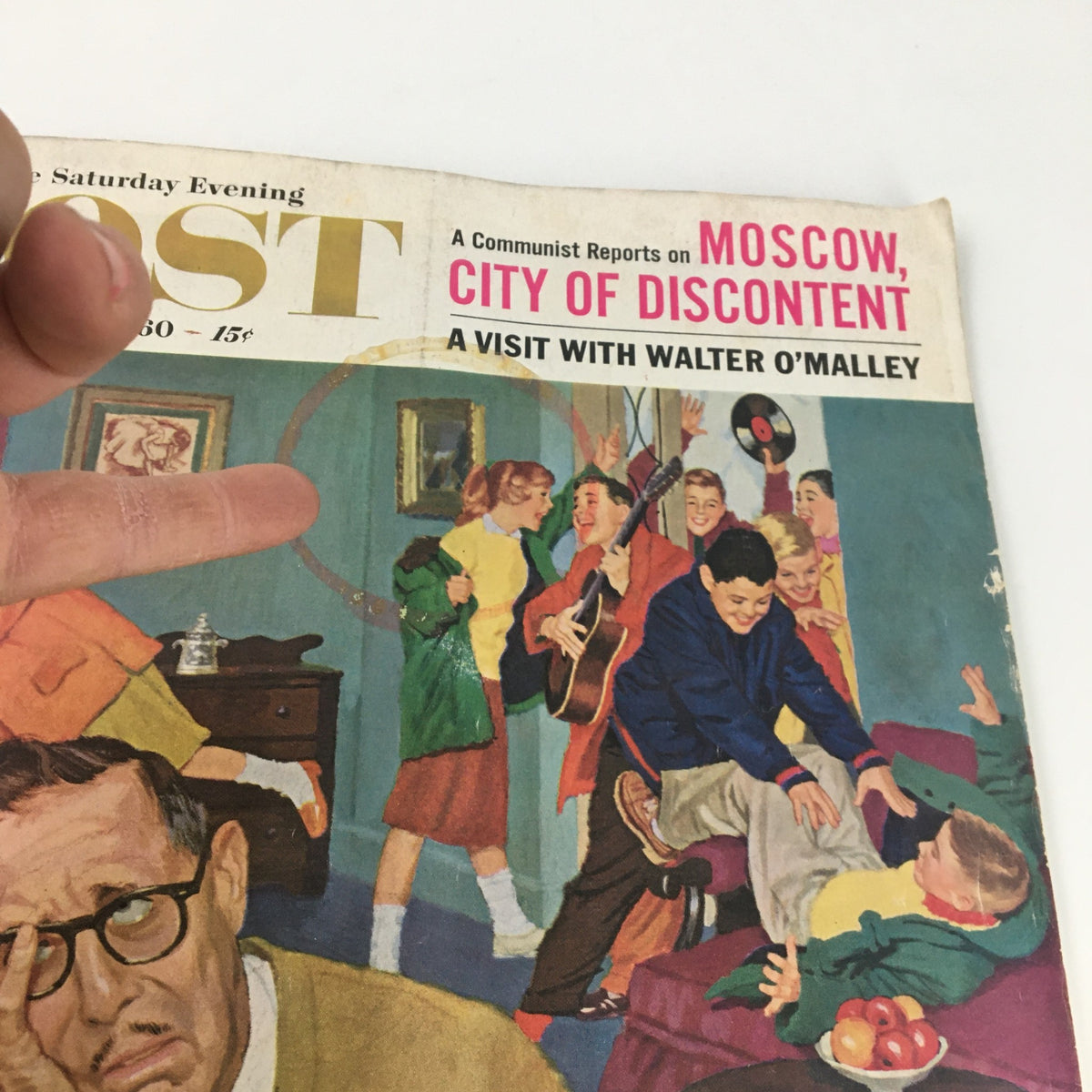 Close-up of the May 14, 1960 cover of The Saturday Evening Post, highlighting Walter O'Malley's feature amidst a lively illustration of family and children, reflecting the spirited atmosphere of the 1960s.