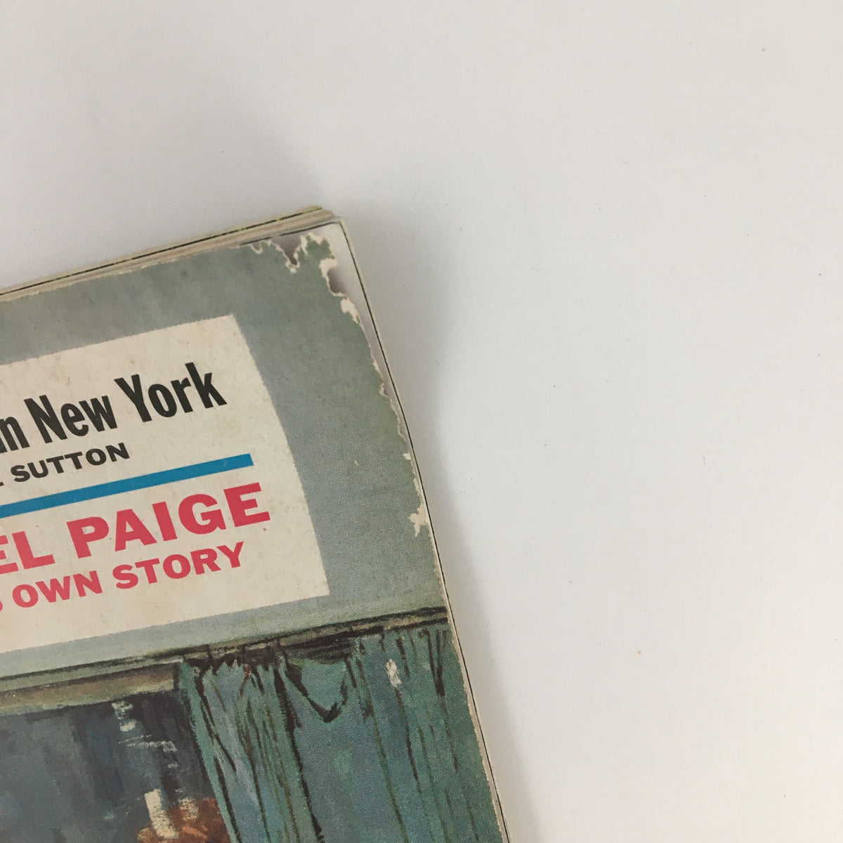 Detail of the cover from The Saturday Evening Post March 11 1961, displaying the title 'Satchel Paige Own Story', showcasing some wear and vintage appeal.