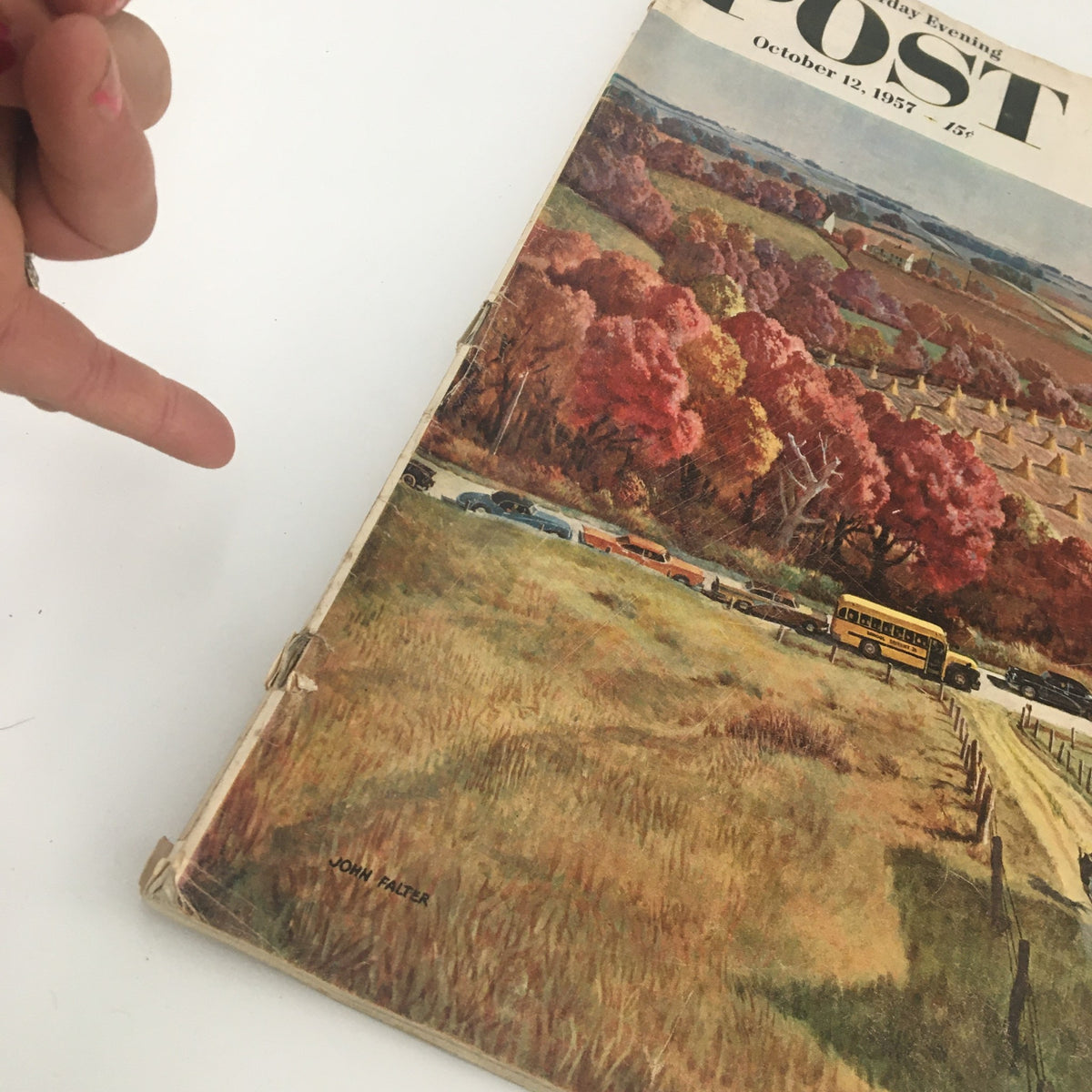 Side view of The Saturday Evening Post October 12 1957 showing minor edge wear, emphasizing the magazine's vintage condition and highlighting the cover featuring West Coast Football.