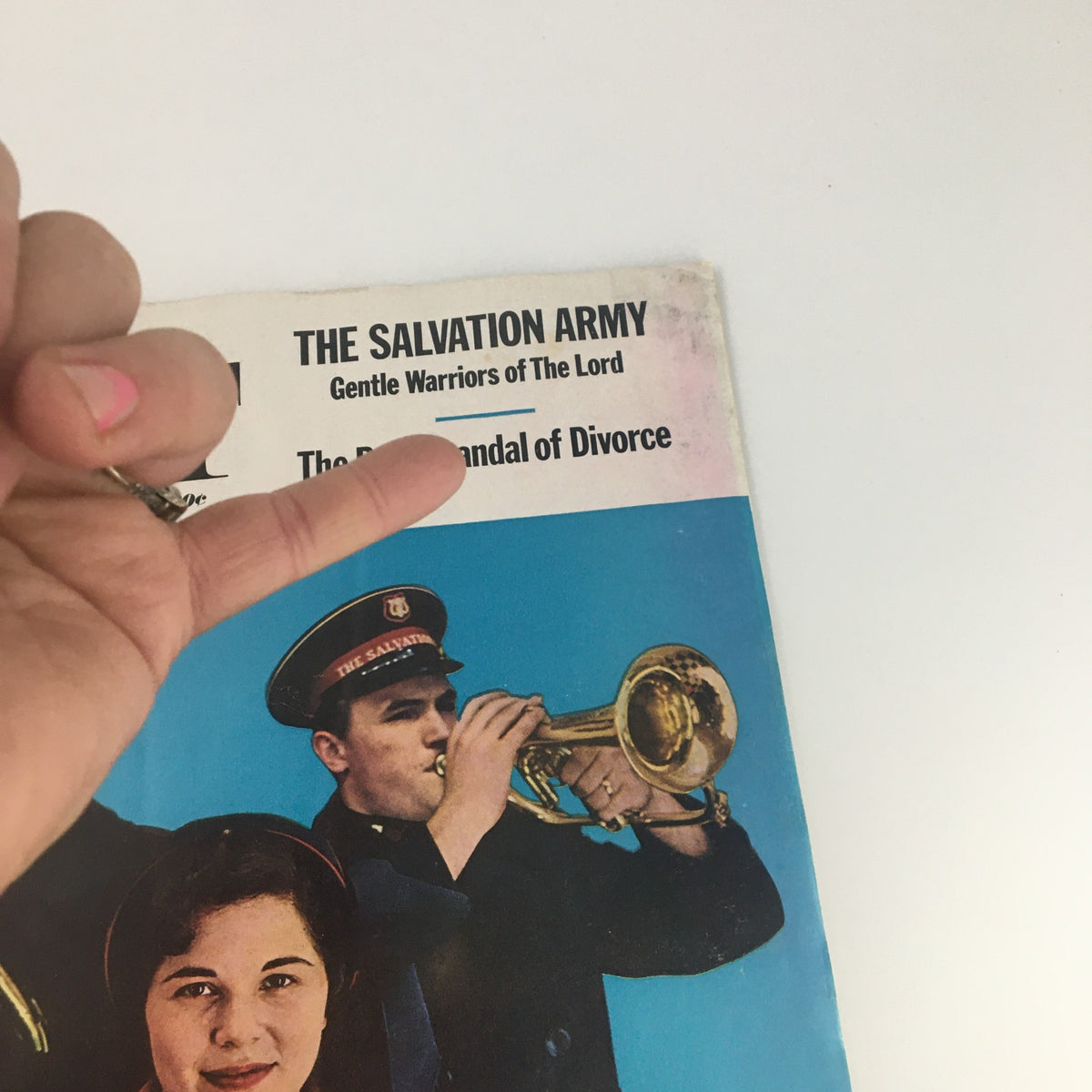 Close-up of The Saturday Evening Post cover from December 15, 1962, highlighting The Salvation Army and featuring a musician playing a trumpet alongside a woman in a red coat.