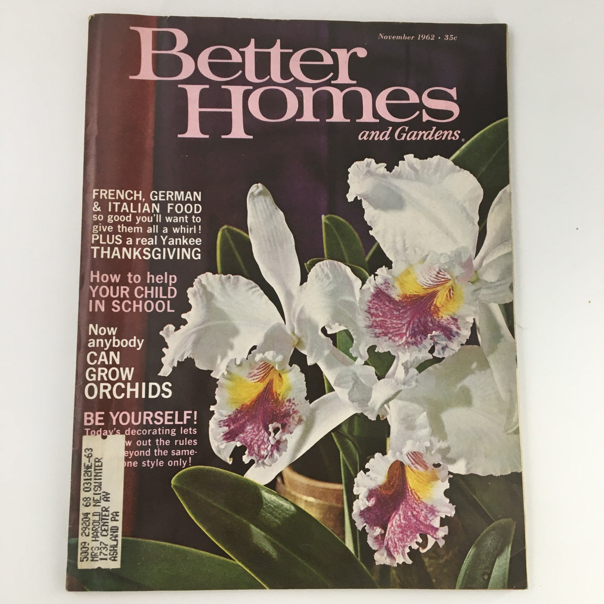 Cover of the VTG Better Homes & Gardens November 1962 magazine featuring a focus on French, German, and Italian food, adorned with a vibrant flower illustration and text highlighting culinary themes.