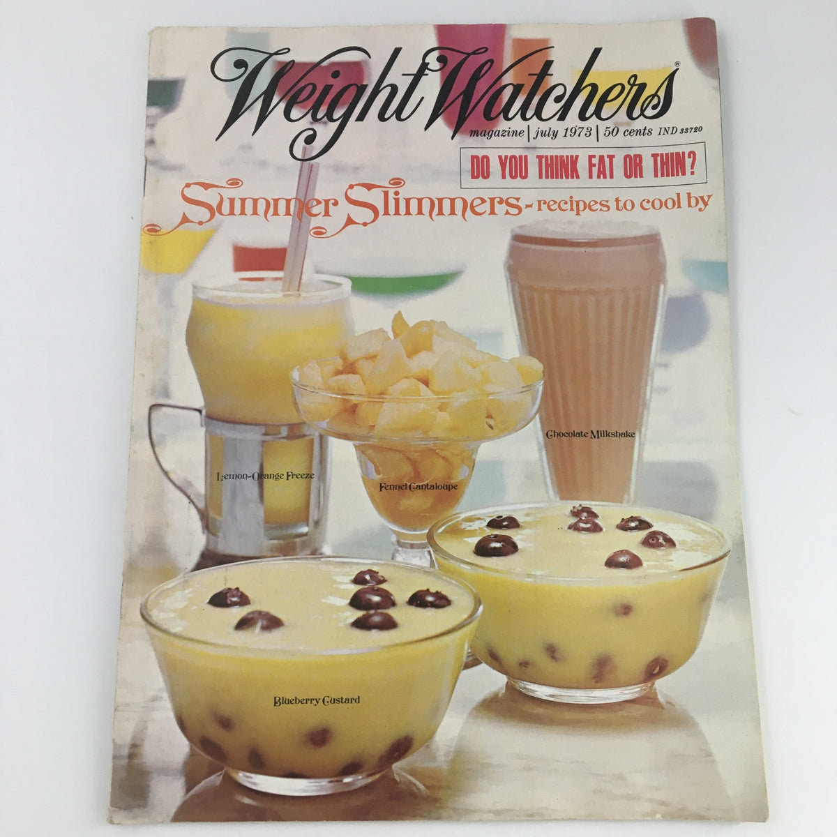 Cover of the VTG Weight Watchers Magazine July 1973, featuring Summer Slimmers recipes, showcasing desserts such as Blueberry Custard, Fennel Cantaloupe, and a Chocolate Milkshake, alongside a Lemon-Orange Freeze drink.