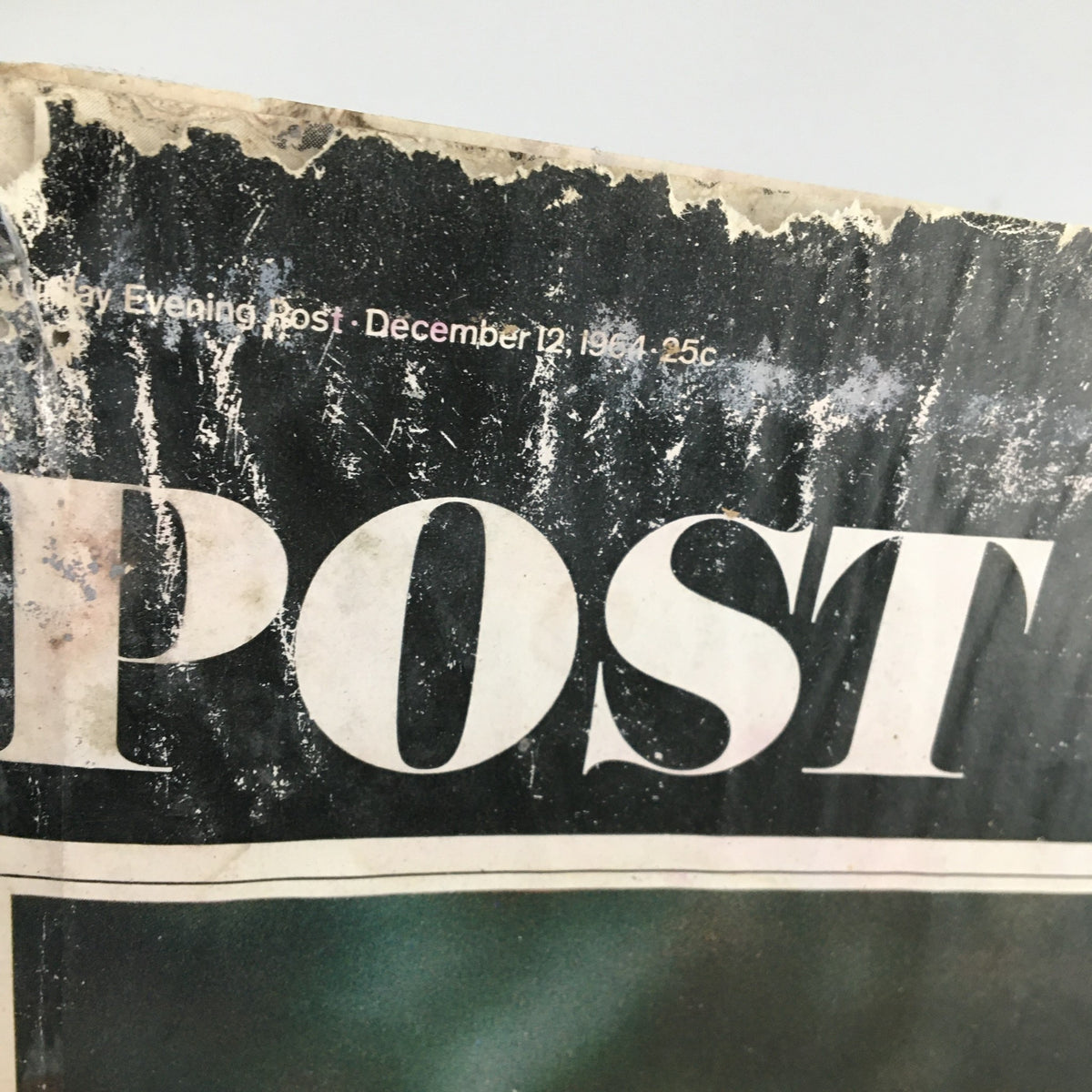 Close-up of the worn cover of The Saturday Evening Post from December 12, 1964, featuring NFL legend Johnny Unitas of the Colts. The cover shows signs of age with scratches and discoloration.