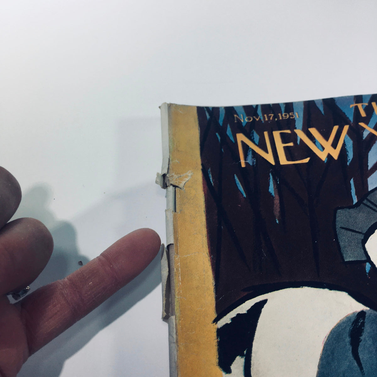 Another close-up of the edge of The New Yorker November 17, 1951 magazine highlighting its vintage condition and binding.