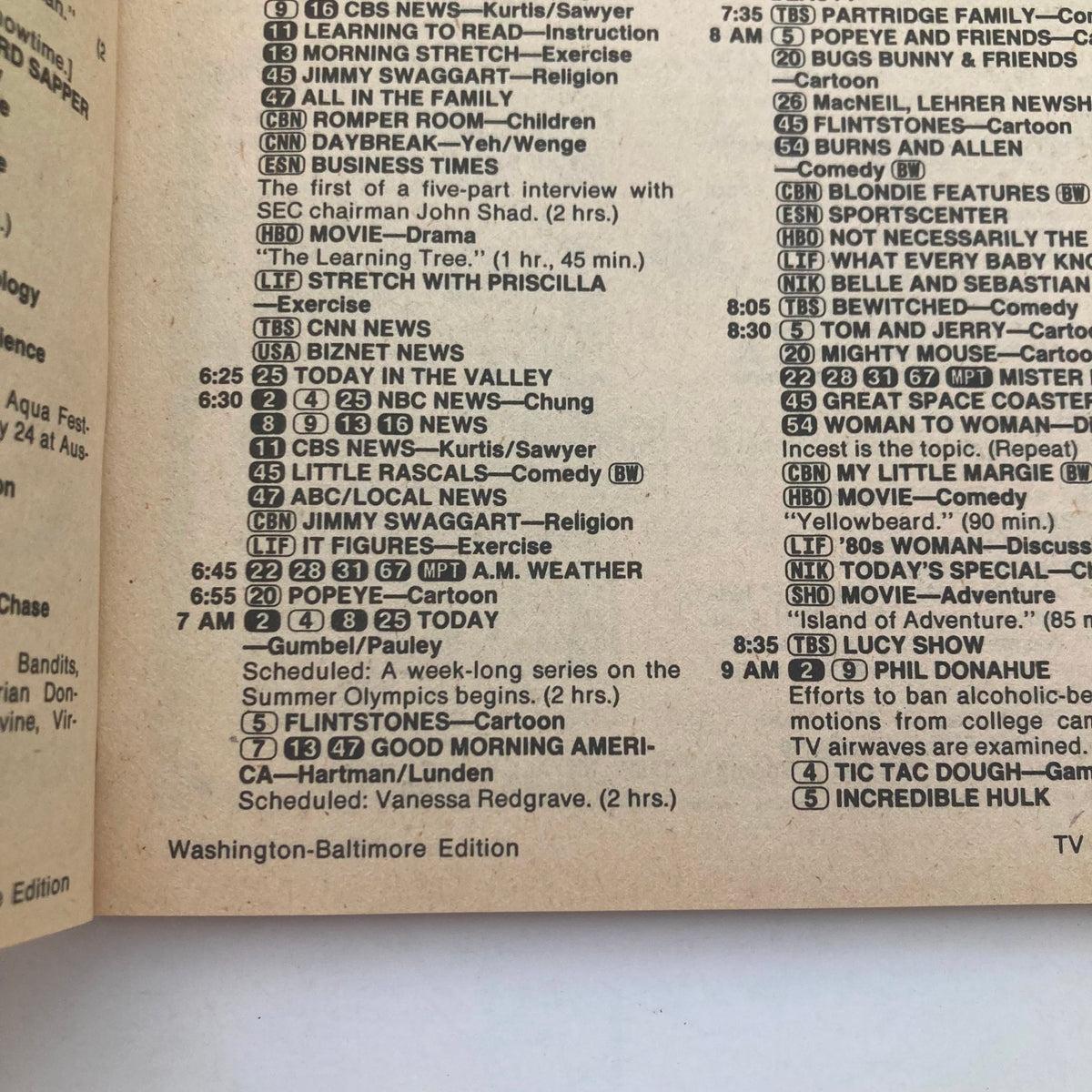 TV Guide Magazine July 28, 1984 Olympic Mischief WA-Baltimore Edition, featuring broadcast listings and programming schedule including notable shows like Popeye, Good Morning America, and various cartoons and news segments.