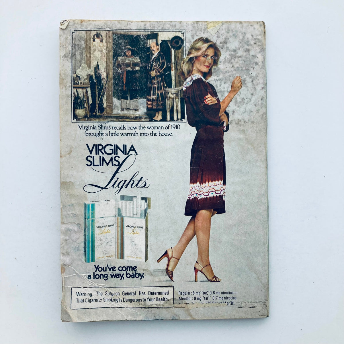 Back cover of TV Guide Magazine December 26 1981 advertising Virginia Slims Lights cigarettes. Features a woman in a dress, emphasizing a nostalgic advertisement style typical of the time.