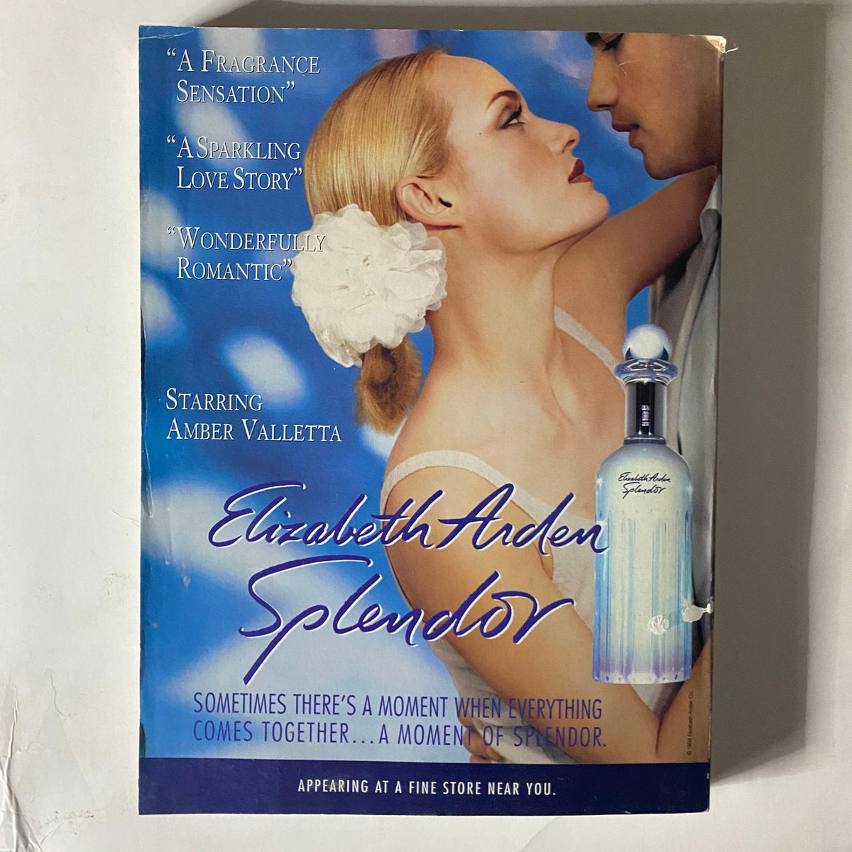 Advertisement for Elizabeth Arden's Splendor fragrance featured in Vogue Magazine October 1998 depicting a romantic scene with Amber Valletta.