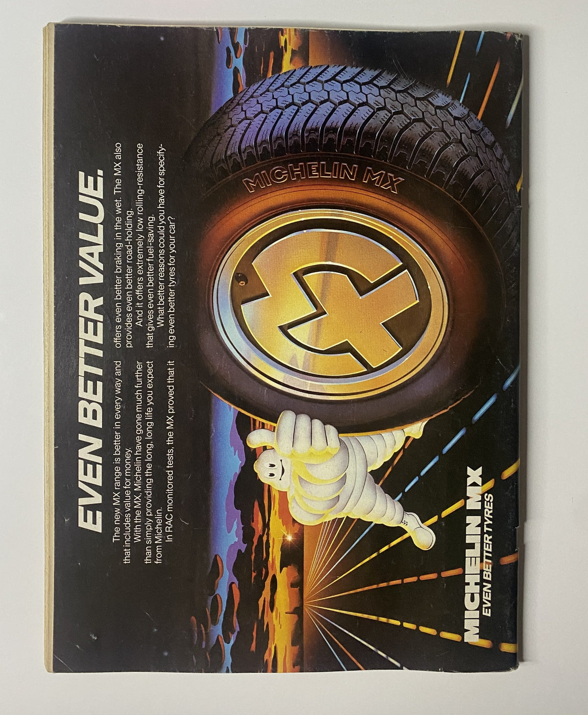 Advertisement featuring Michelin MX tires, highlighting the message 'Even Better Value' alongside a visual of a Michelin man mascot and tire design, associated with CAR Magazine April 1984 featuring Ferrari 512BB, Countach, and 911 Turbo supercar tests.