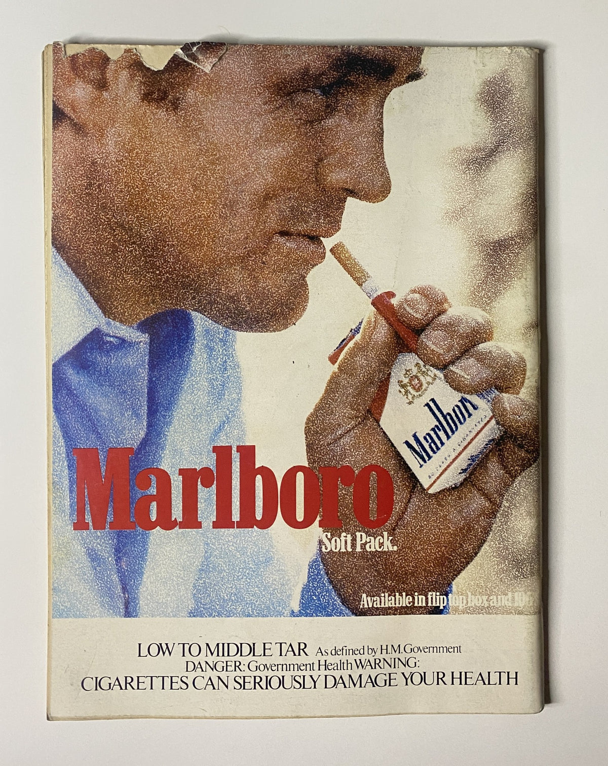Advertisement for Marlboro cigarettes in CAR Magazine September 1983, highlighting the soft pack design and health warning.