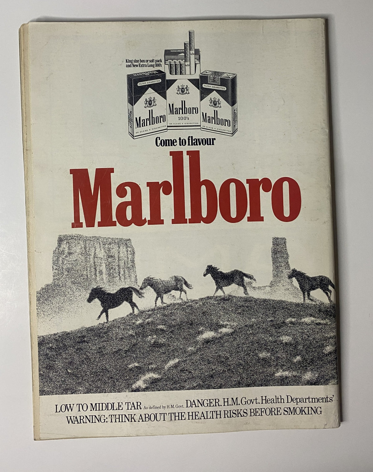 Marlboro advertisement from the 1983 era showcasing horses in a scenic landscape, included in the Car Magazine April 1983 issue.