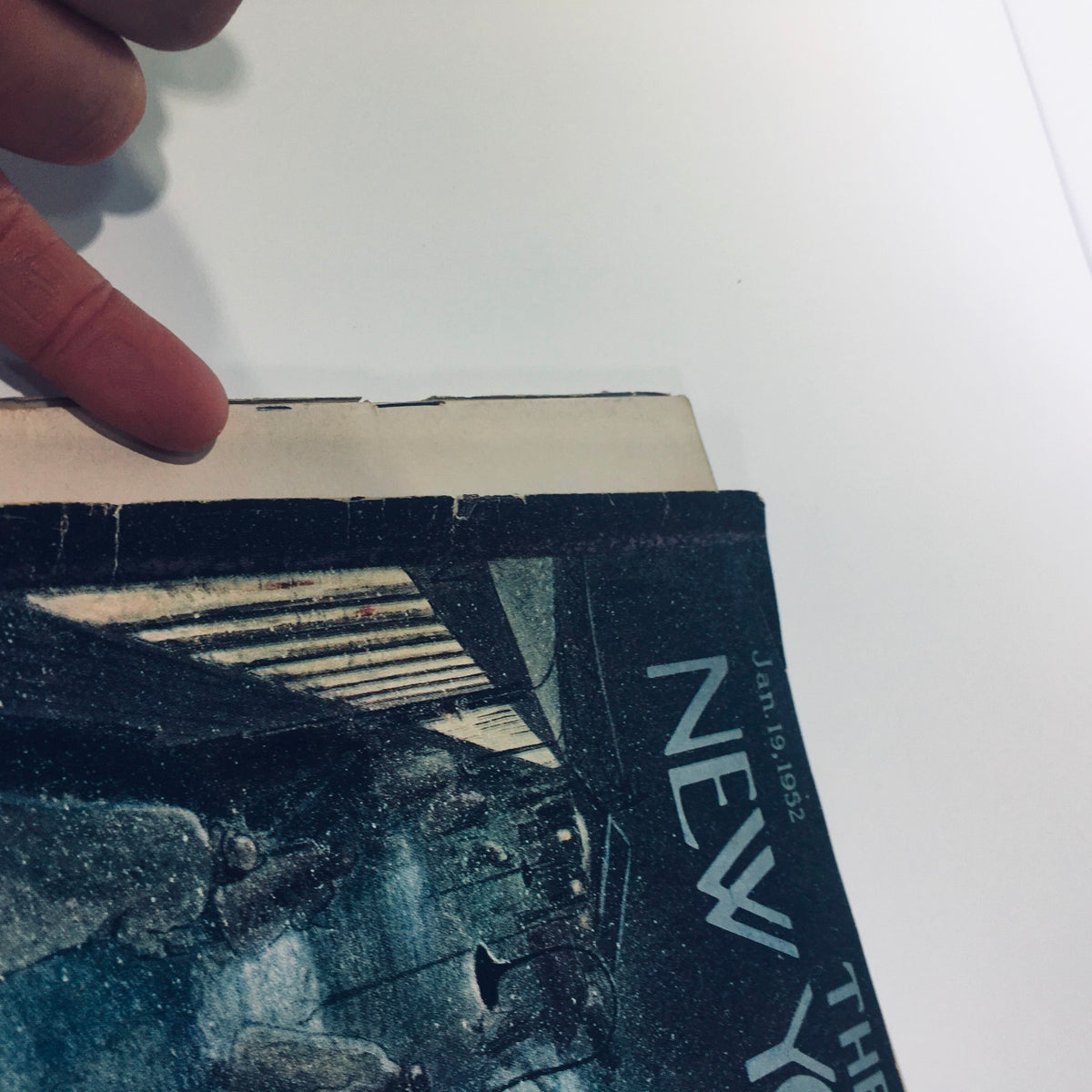 Detailed view of the spine and edge of The New Yorker: January 19 1952 magazine, highlighting signs of wear yet retaining its collectible appeal.