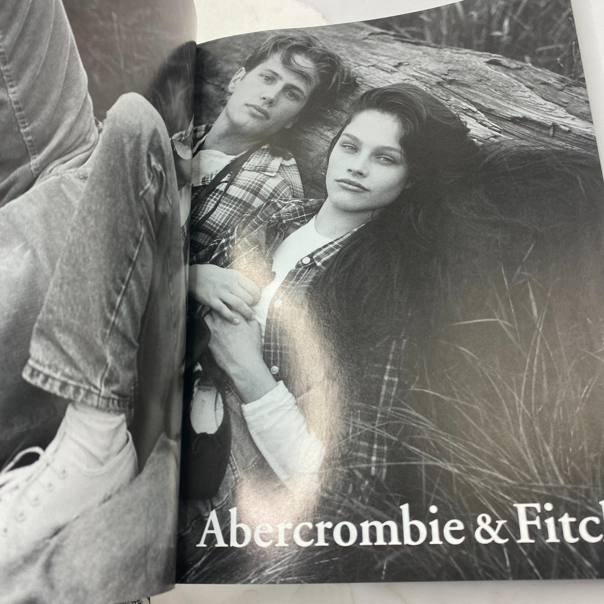 Black and white fashion editorial page featuring models styled in Abercrombie & Fitch apparel from Vogue Magazine September 1995.