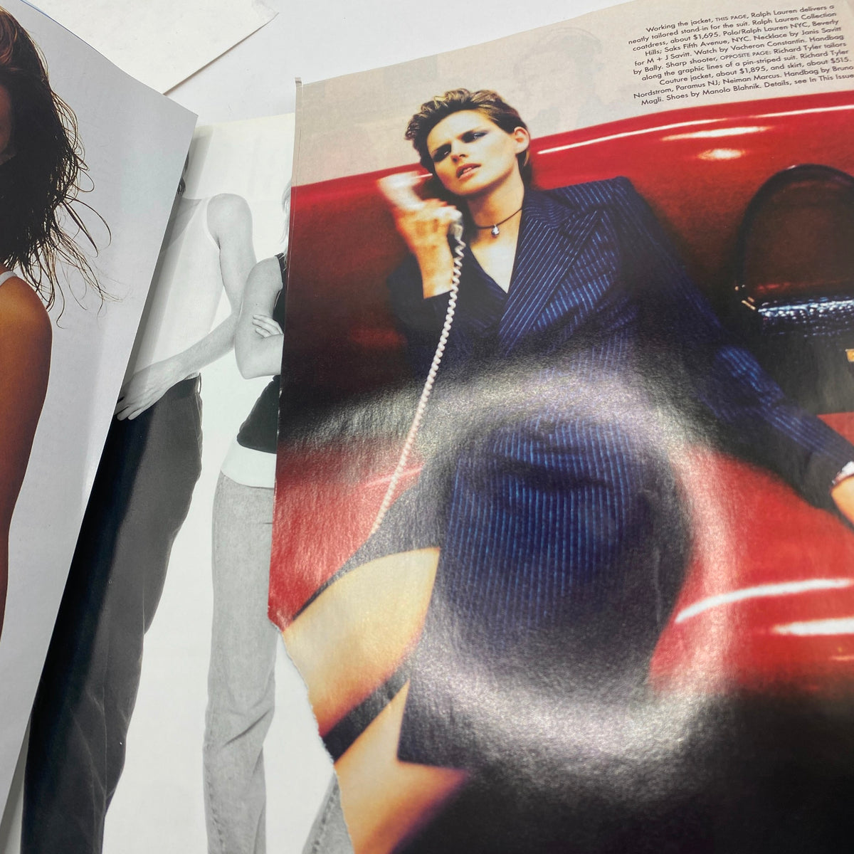 Inside Vogue Magazine August 1997 featuring Georgina Grenville on the cover, showcasing a stylish model dressed in a dark pinstriped suit, seated and holding a phone. The image captures the vintage aesthetic popular in fashion photography of the time.
