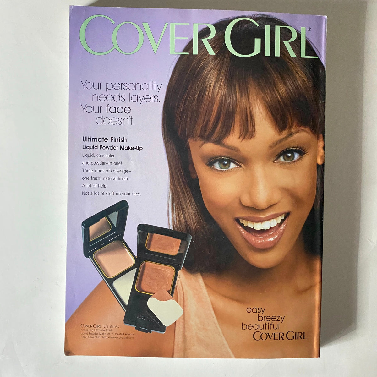 Vogue Magazine May 1997 Georgina Grenville Cover highlighting a Cover Girl makeup advertisement featuring Tyra Banks and product details.