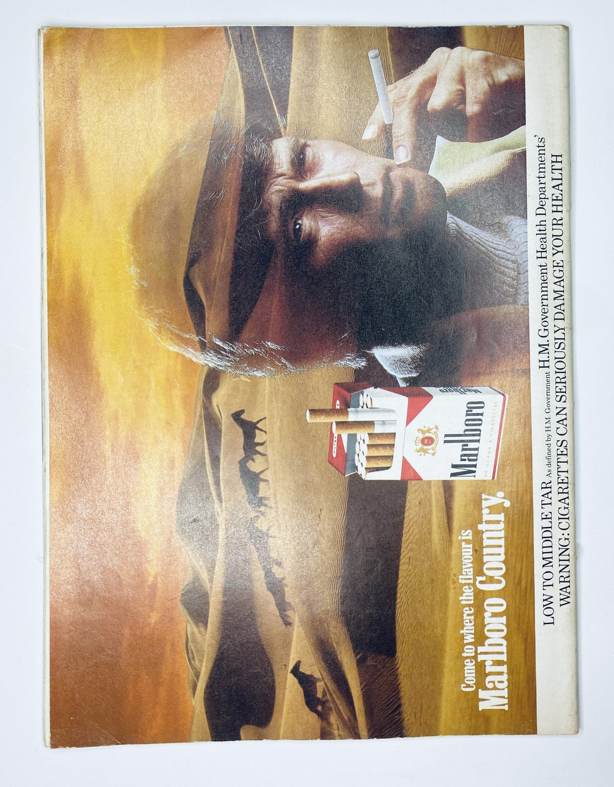 Cover of Car Magazine from December 1980 featuring a Porsche 911 survivor test, a Marlboro advertisement with a man smoking in desert scenery, showcasing automotive trends of the time alongside reviews of Opel, Bitter, Escort, Kadett, and Golf.