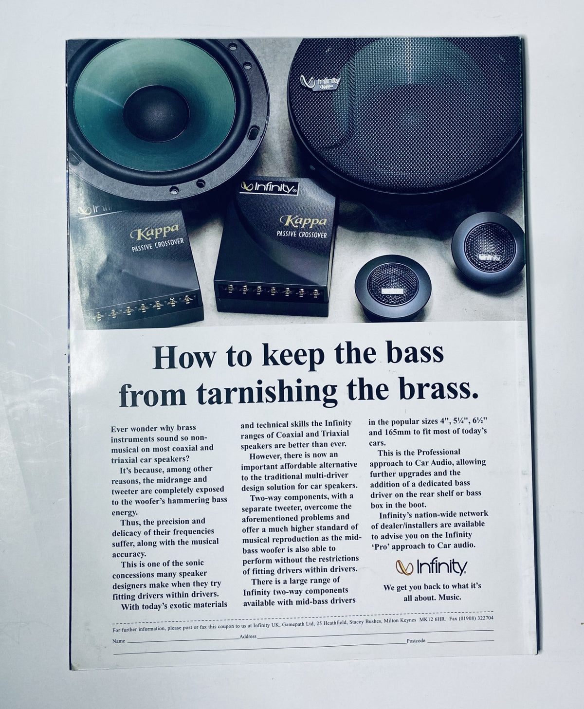 Vintage advertisement for Infinity speakers in CAR Magazine, focusing on audio quality and design features.