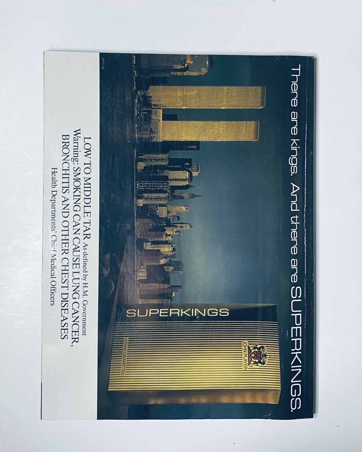 Car Magazine December 1987 advertisement showcasing Superkings cigarettes against a backdrop of the New York City skyline, promoting a luxurious lifestyle.